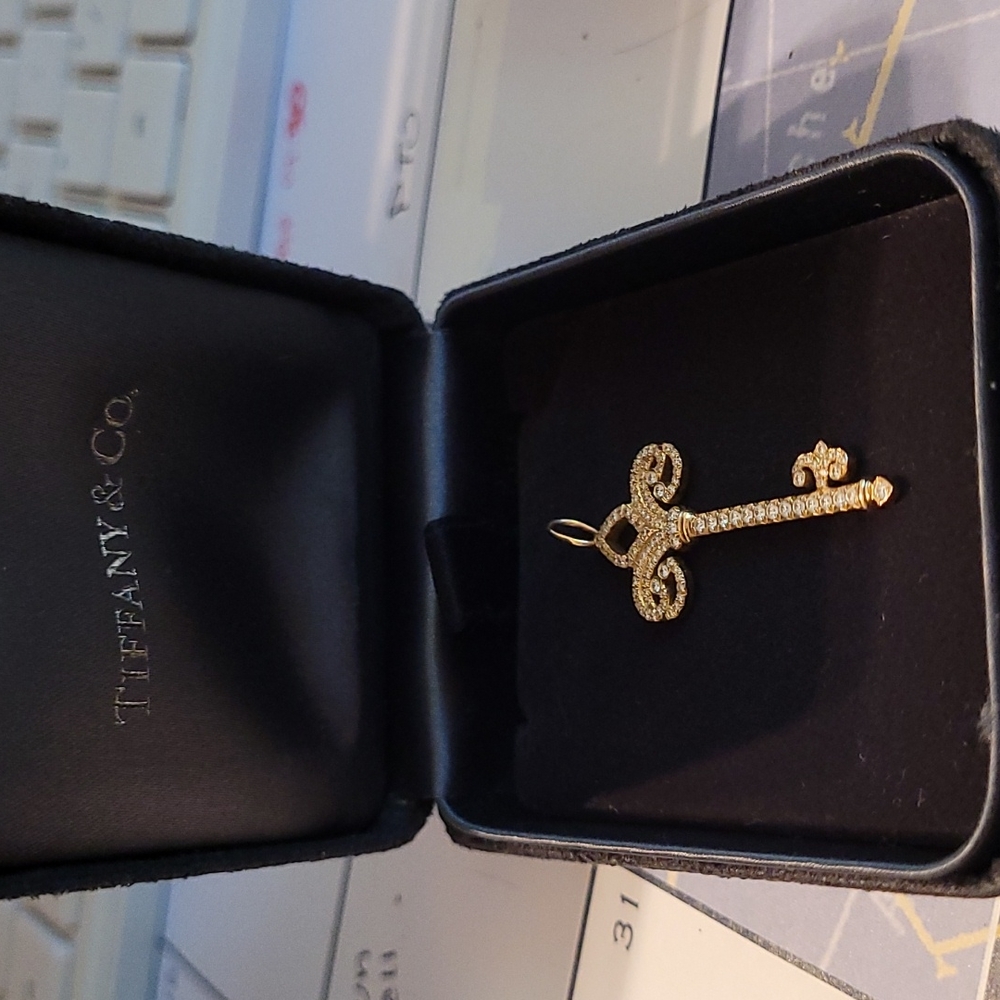 Tiffany and Co. 18k gold and diamond Fleur-de-lis pendant
